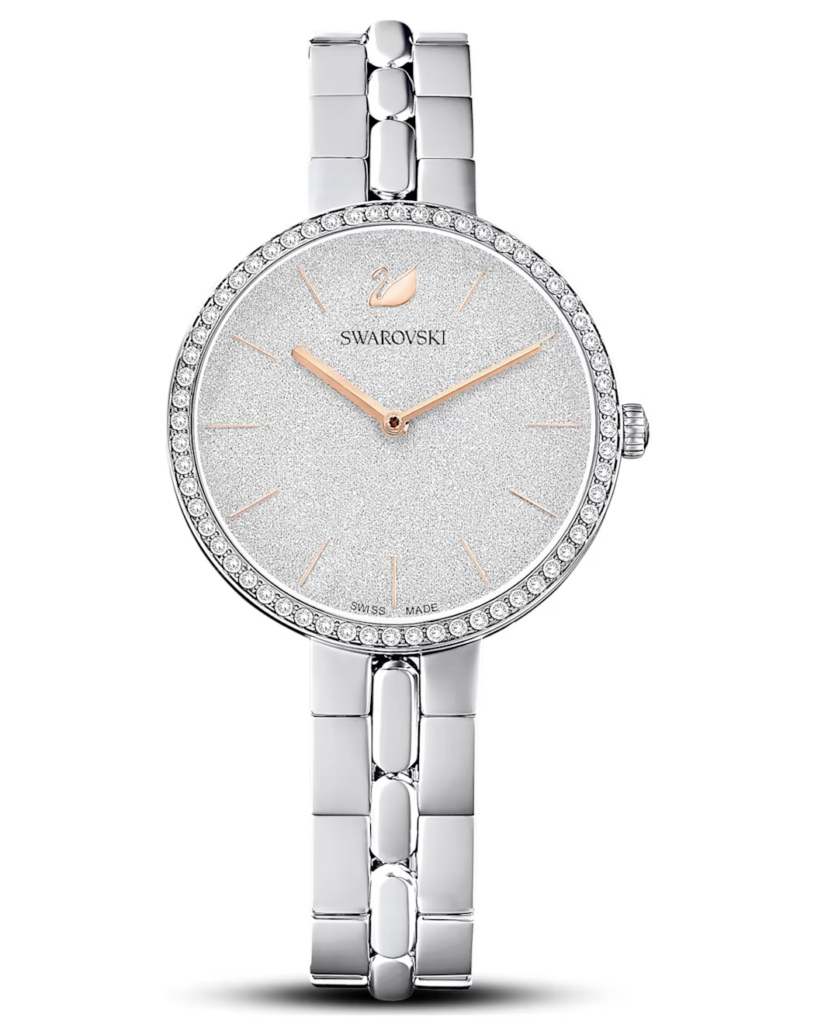 A Swarovski crystal-encrusted silver watch with a glittering face and sleek metal band, reflecting luxury and elegance.